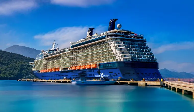 A modern luxury cover of a Celebrity Edge-class ship, showcasing 2026 promotions for The Retreat and global voyages.