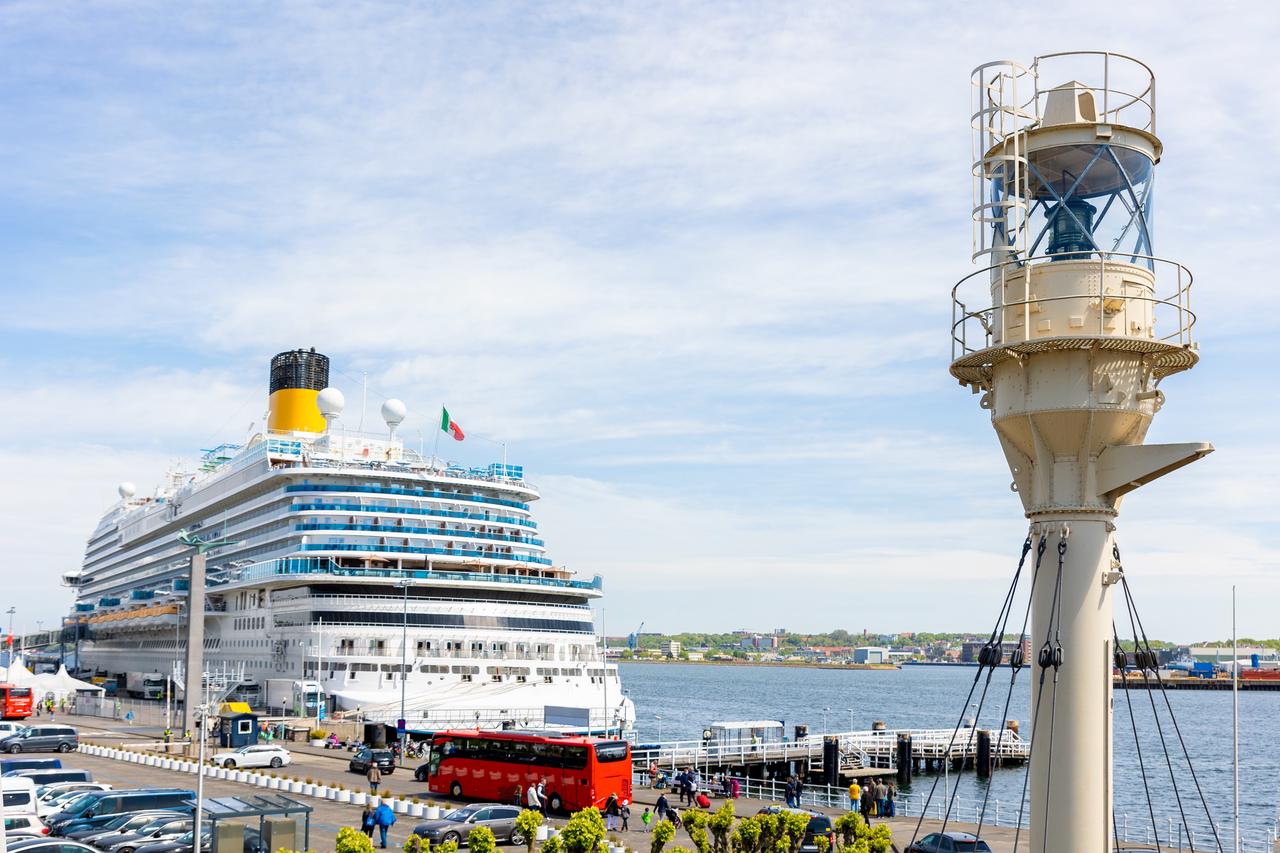 Distant view of the port with passengers preparing to board the ship