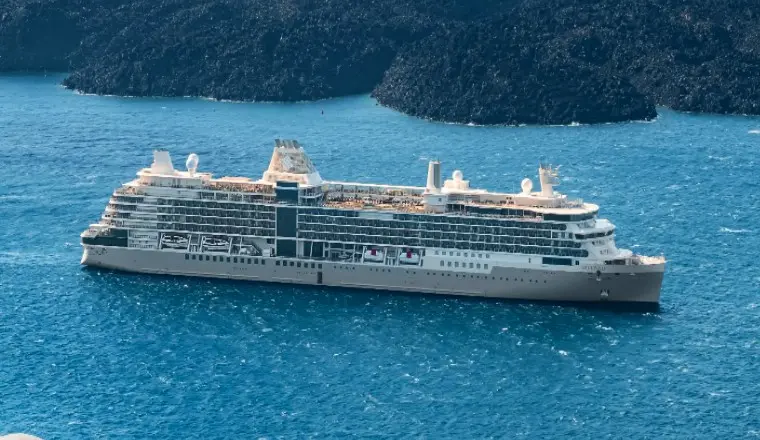An elegant Silversea ship on the sea at sunset, highlighting 2026 ultra-luxury boutique cruise promotions and all-inclusive deals.