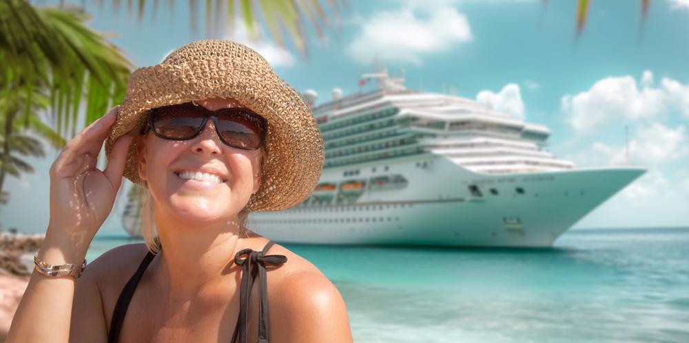 Woman in sunglasses posing with a cruise ship