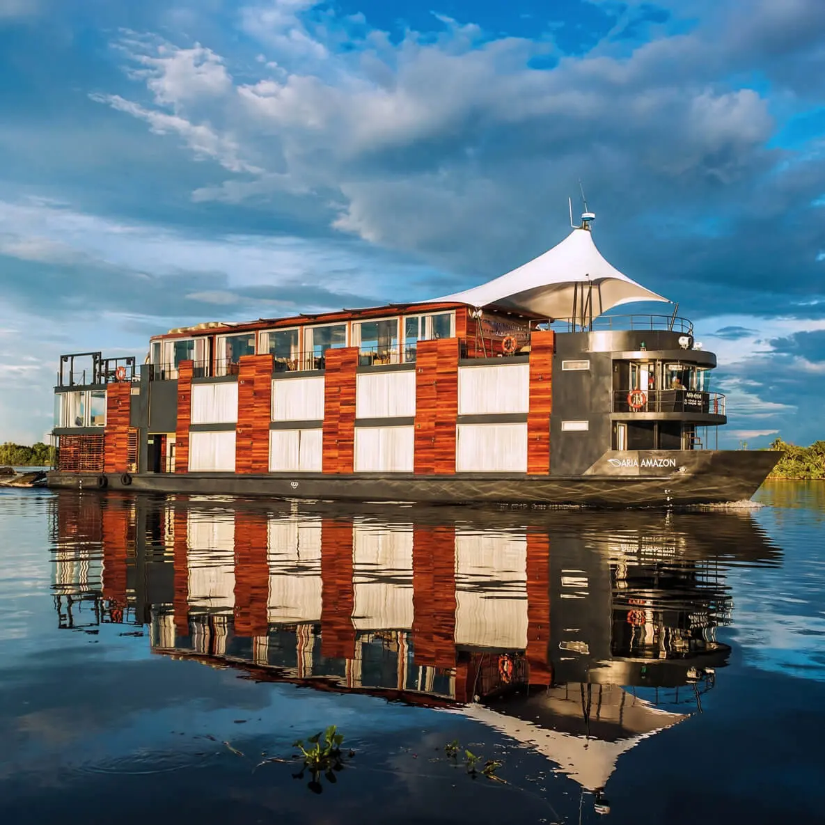 Designed to explore the Peruvian Amazon in luxury and comfort, the Aria Amazon is an all-suite ship with floor-to-ceiling windows, giving you a full view of the majestic rivers and rainforest. The top deck features a jacuzzi, indoor lounge &amp; bar and an outdoor observation deck. With all-inclusive amenities and five-star cuisine by top chef Pedro Miguel Schiaffino, this luxurious ship is guaranteed to give you an intimate and immersive experience.