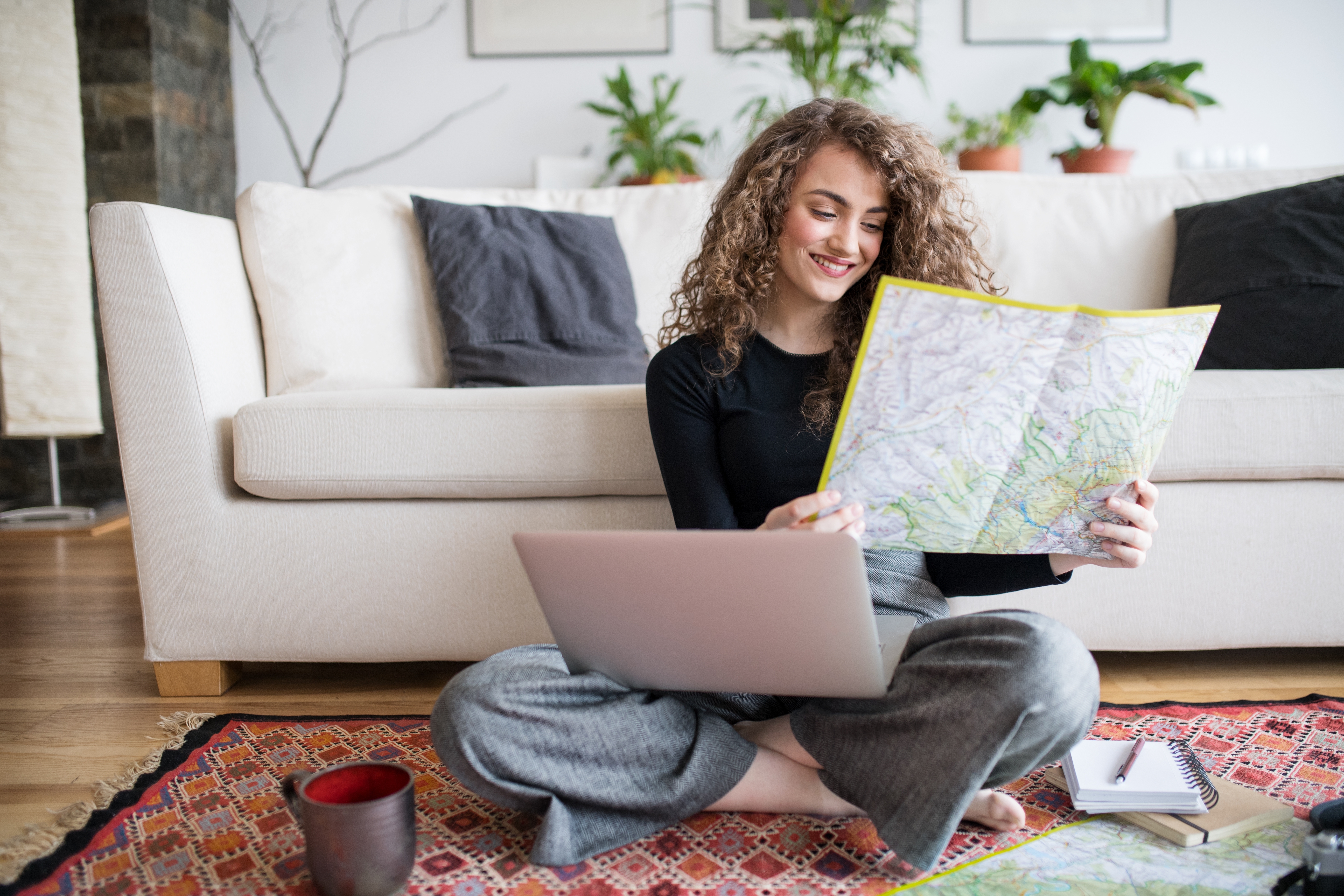 a woman looking map at home