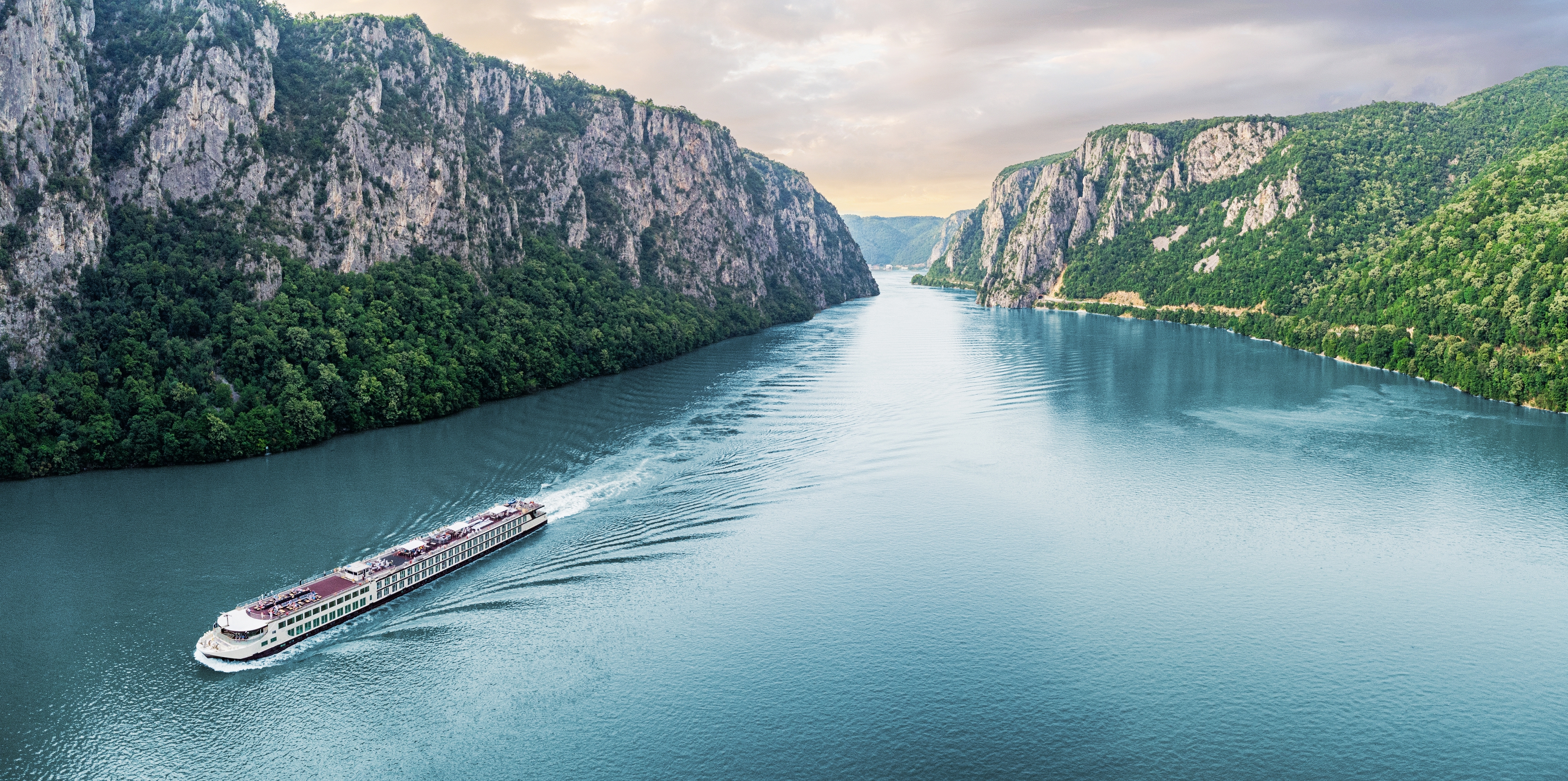 Passenger vessel cruising through the gorge on a summer vacation trip