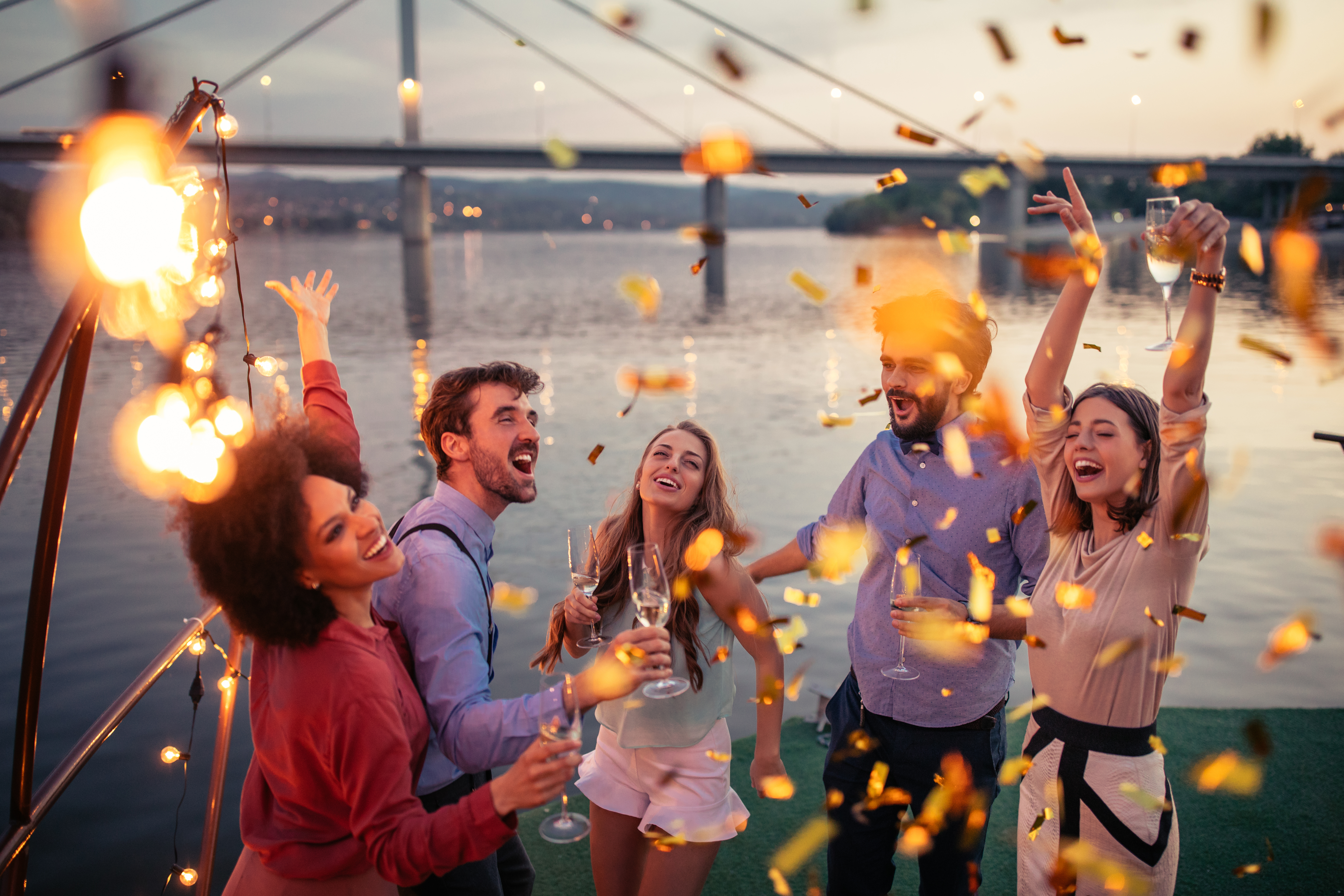 Group of friends dancing on a river cruise