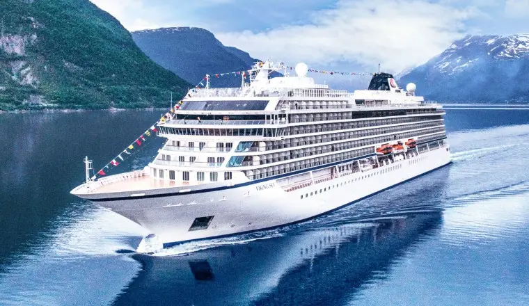 An aerial cover of a Viking Ocean ship with mountains, highlighting 2026 early booking and airfare-inclusive deals.