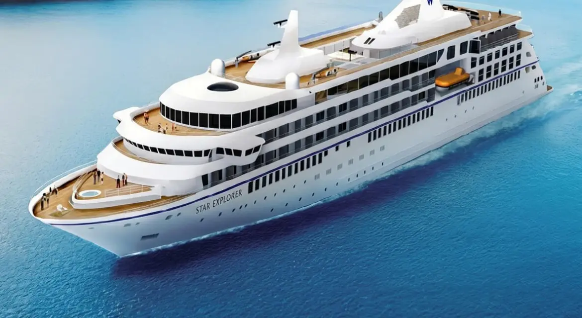 Windstar Cruises 2026 brand collection: elegant yacht-style ship sailing through turquoise island waters beneath a glowing tropical sunset. Experience 2026 with Windstar Cruises. Enjoy breathtaking sunset sailings, intimate small-ship luxury, and immersive journeys to hidden ports.