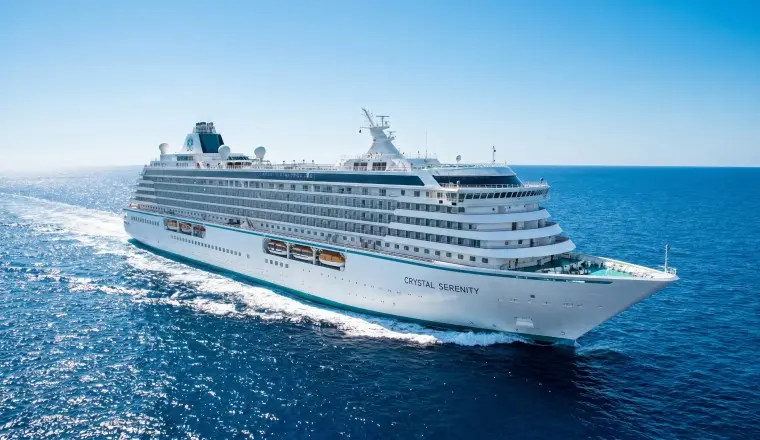 A sophisticated cover of a Crystal Cruises ship at sunset, showcasing the 2026 luxury cruise sales event.