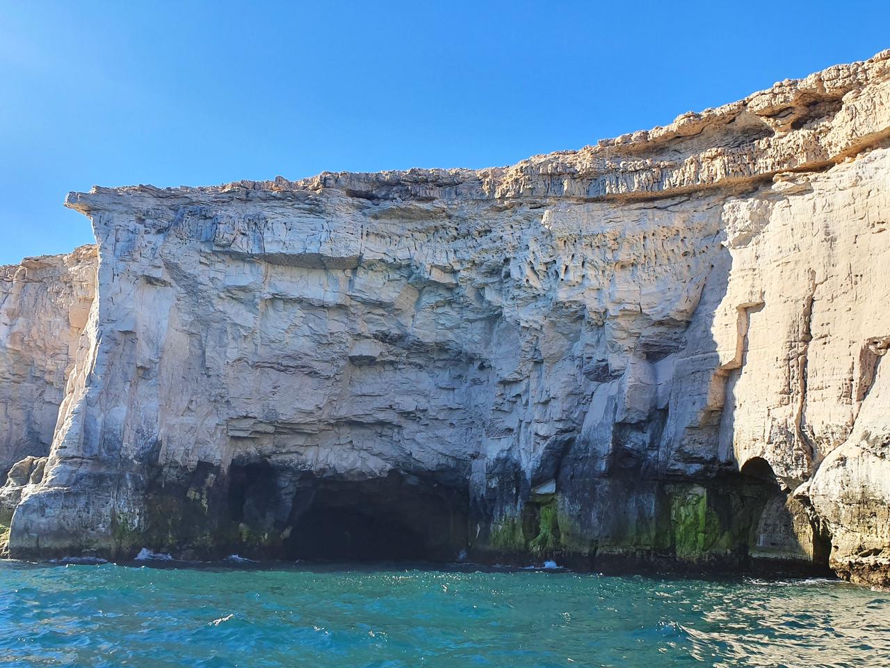 The tranquil body of water with towering rocky cliffs. Baja California, Mexico