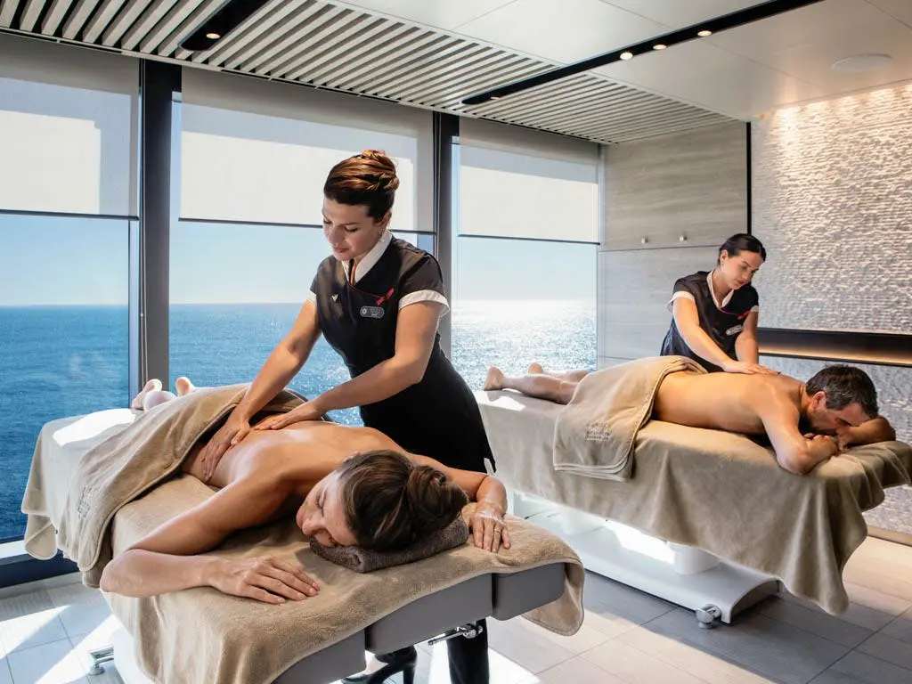 Guests receive side-by-side massages with panoramic ocean views at the spa aboard Le Commandant Charcot, Ponant's luxury polar icebreaker.
